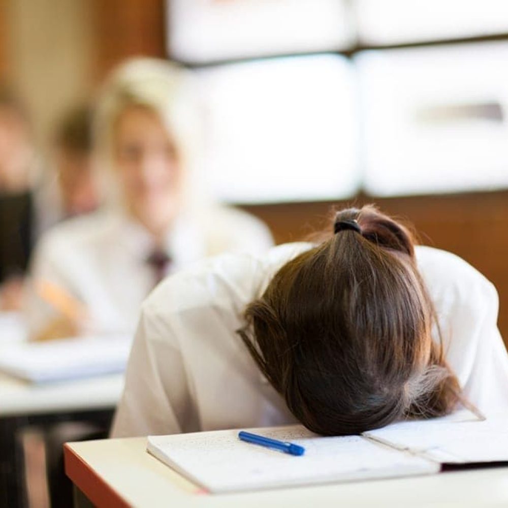 frustrated high school student in classroom