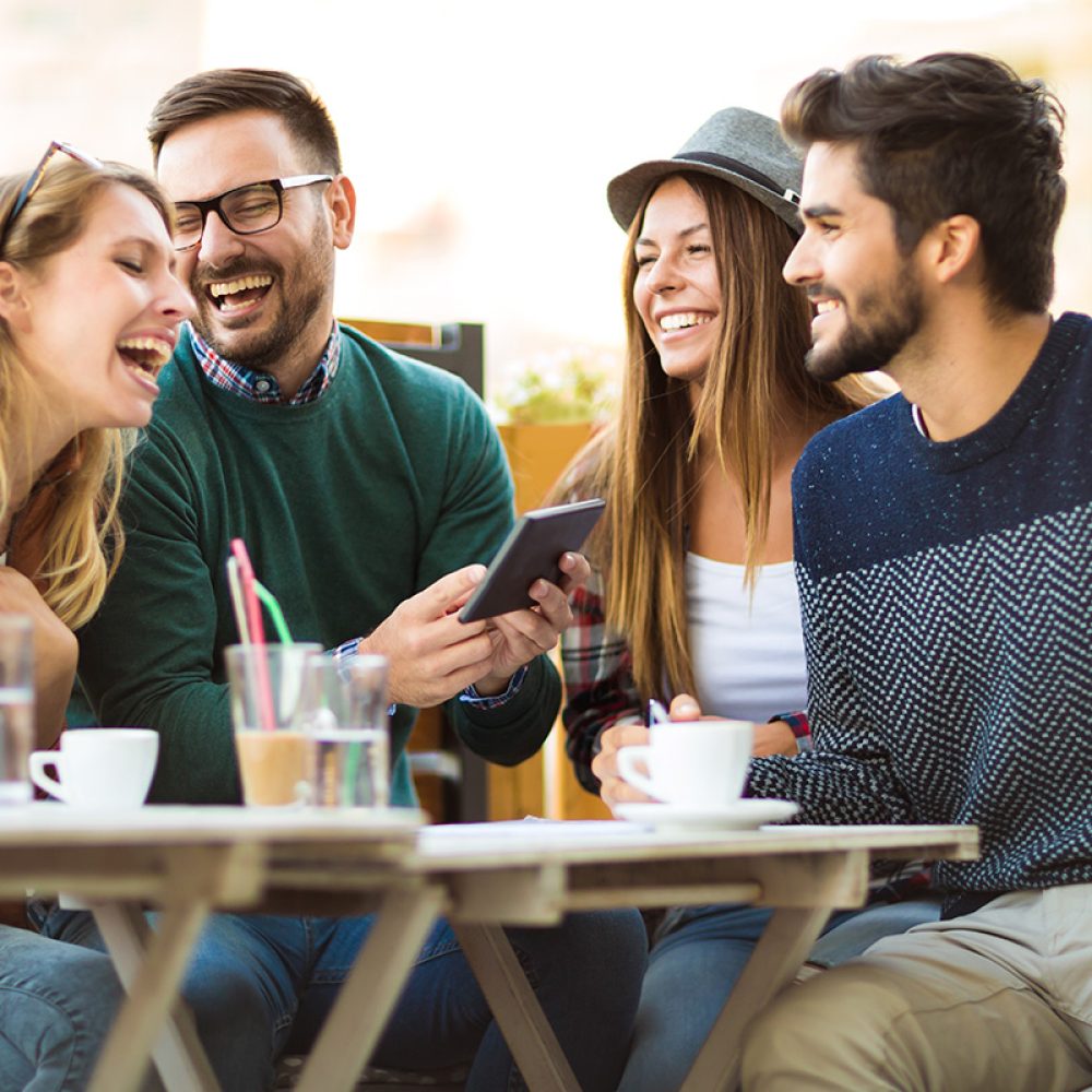 Group,Of,Four,Friends,Having,A,Coffee,Together.,Two,Women